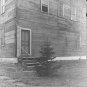 SA0376 - Photo shows steps and a door to a wooden building. Caption on the back: 